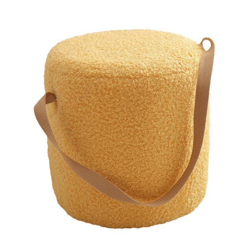 Yellow textured bag with a strap on a white background