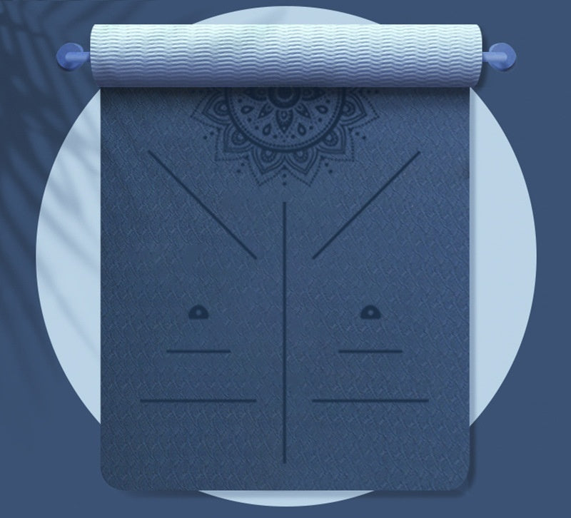 Dark blue yoga mat with light blue textured handle on a white background