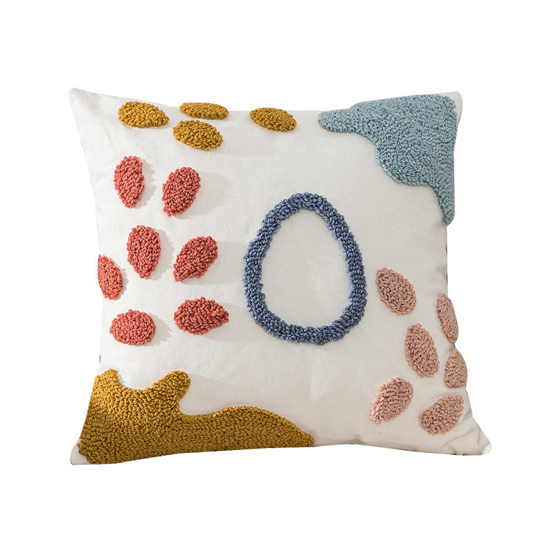 Decorative pillow with colorful abstract patterns on a white background
