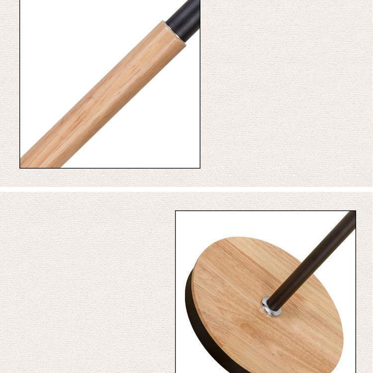 Close-up of a wooden stand with black base on a light gray background