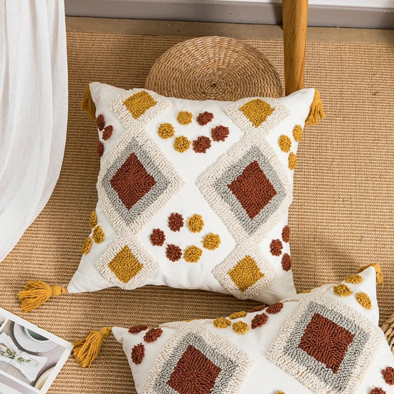 Decorative pillow with geometric pattern on a woven surface