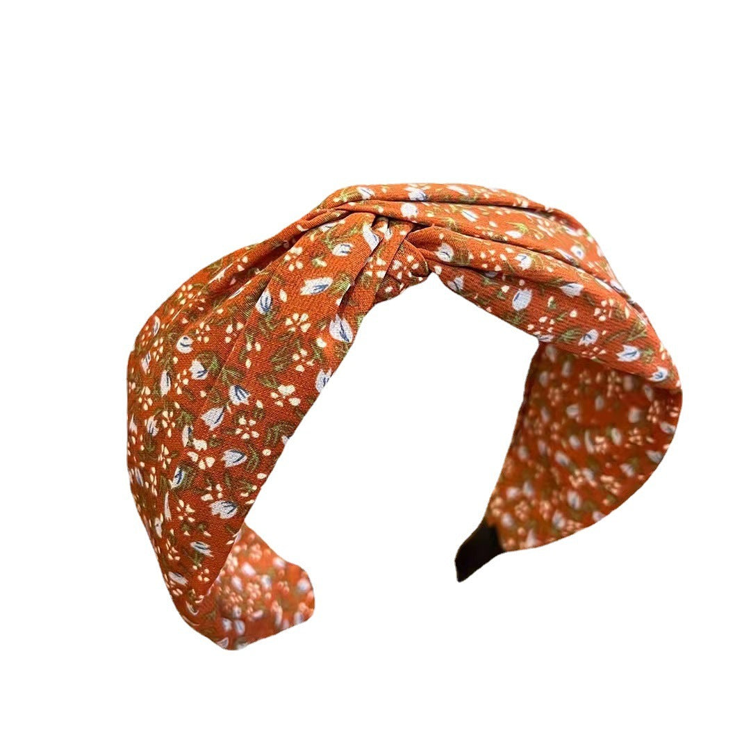 Floral patterned headband on a white background