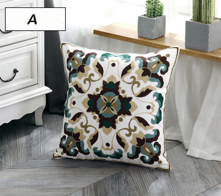 Decorative pillow with intricate patterns on a wooden floor