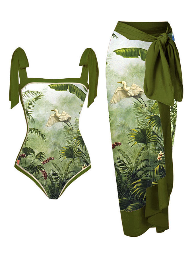 Jungle-themed swimsuit with green and white design on a white background