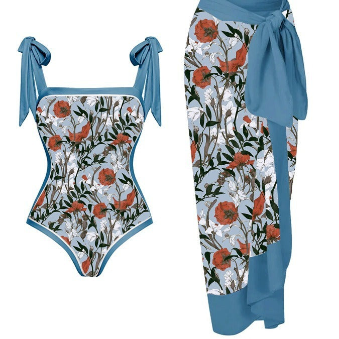 Floral swimsuit with blue accents on a white background