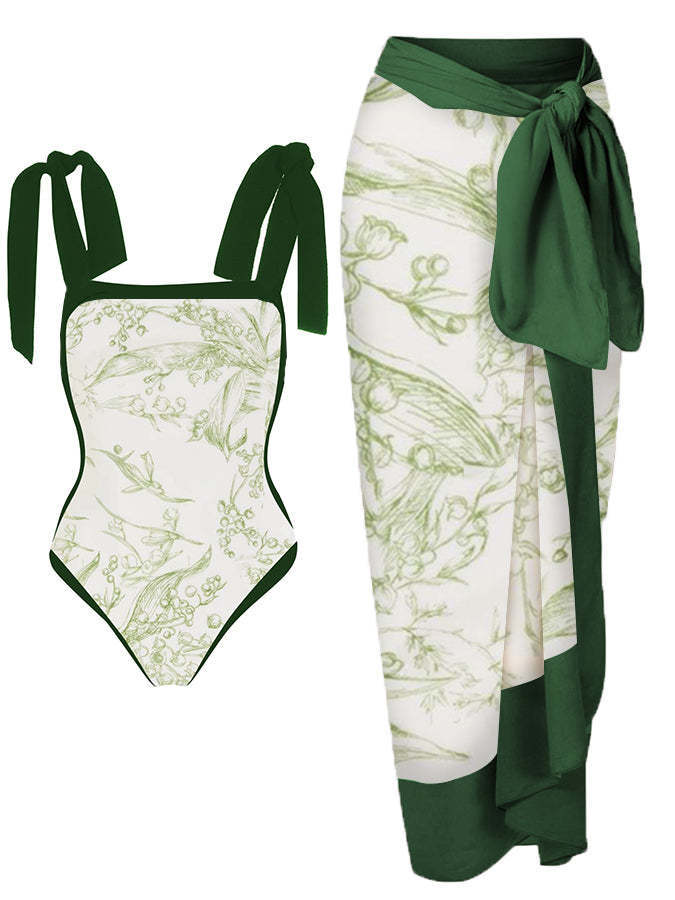 Green and white swimsuit with matching wrap on a white background