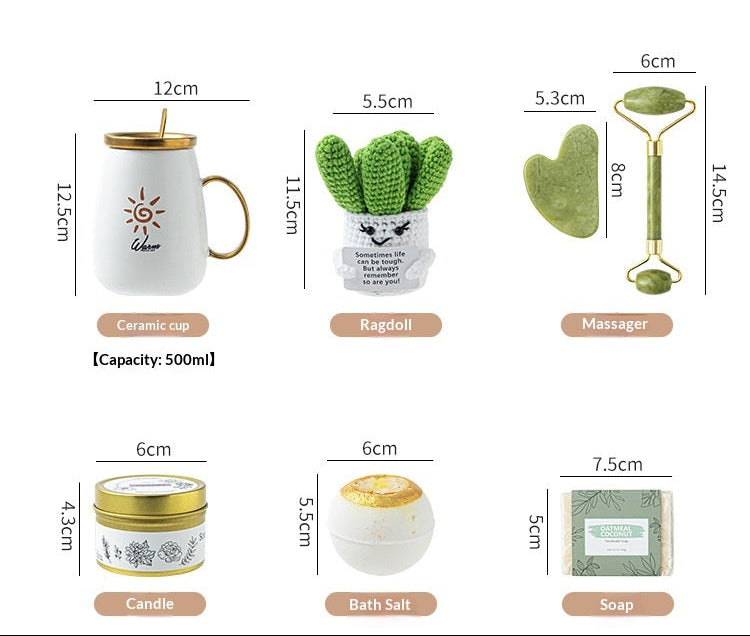 Gifting set with blanket, mug, candle, and small plant on a neutral background