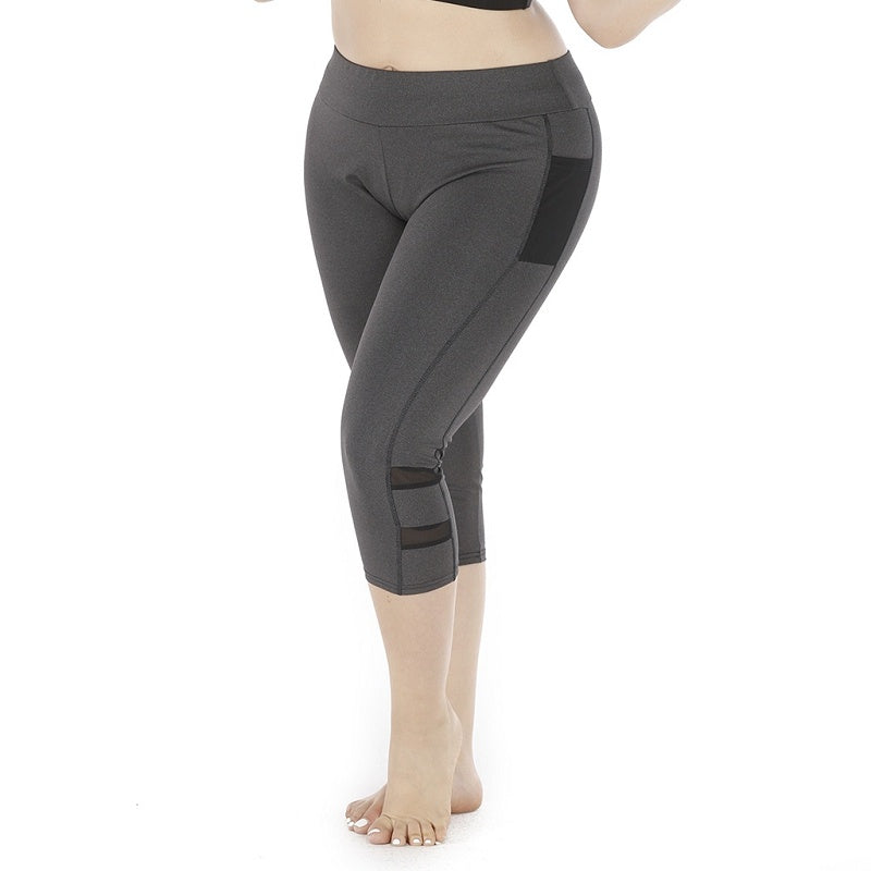Gray leggings with mesh panels on a white background