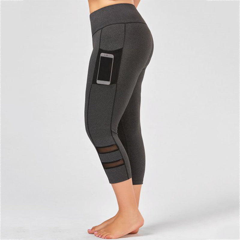 Dark gray leggings with a pocket on a light gray background