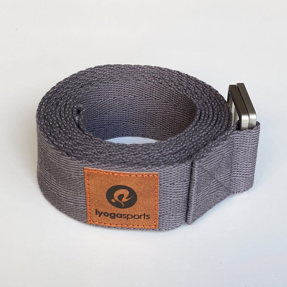 Gray yoga strap with a brown leather patch displaying 'lyogasports' logo on a light gray background