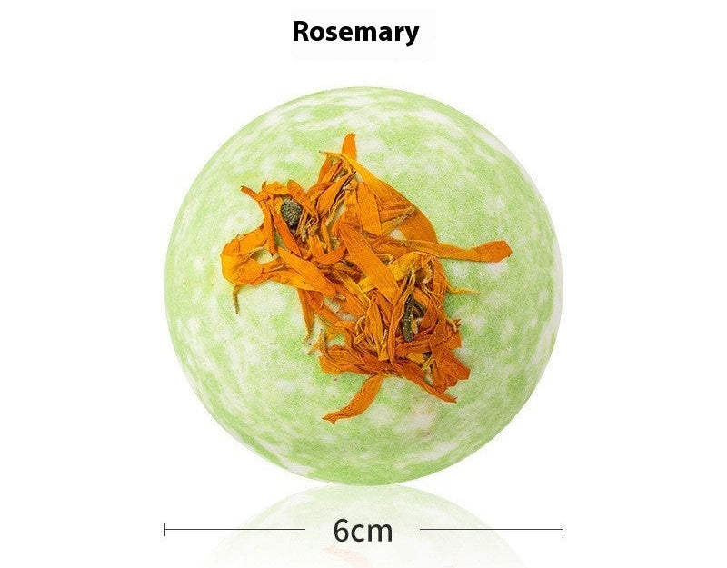 Green bath bomb with rosemary leaves on a white background