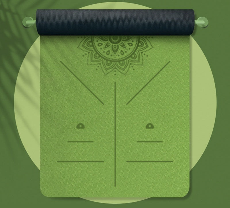 Green yoga mat with black rolled-up mat on a green background
