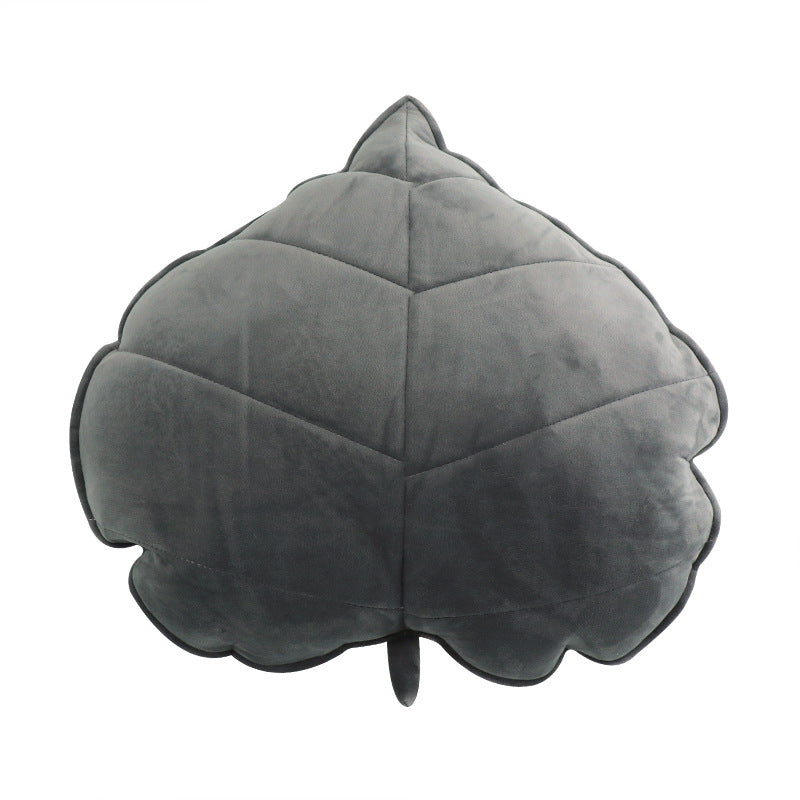 Gray leaf-shaped pillow on a white background