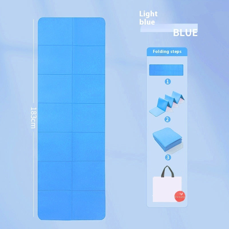 Light blue mat with folding instructions on a light blue background