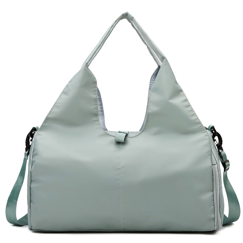 Light gray handbag with a shoulder strap on a white background