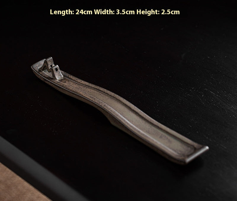 Long-lasting incense holder on a dark background with dimensions displayed.