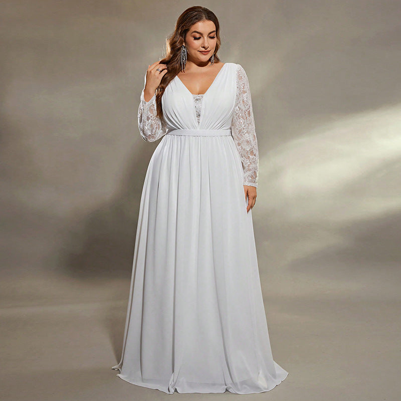 Woman wearing a white lace dress against a neutral background
