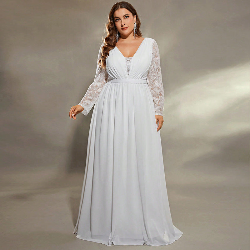 Woman wearing a white lace dress against a neutral background bridal