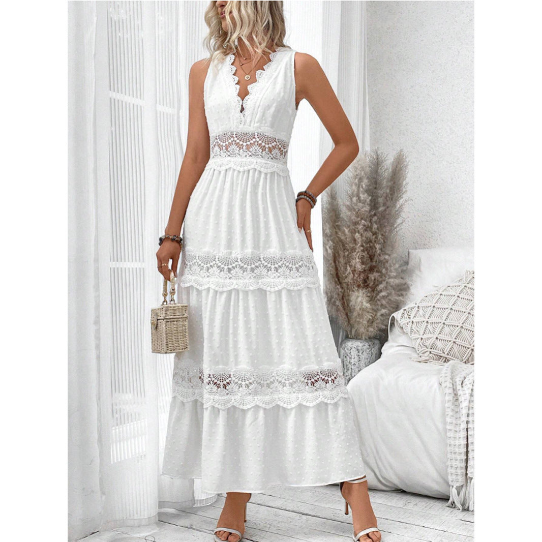 Woman wearing a white lace dress in a bright room.