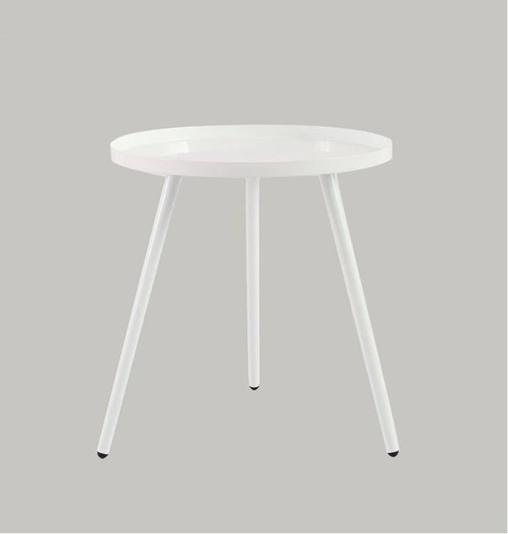 Round white table with three legs on a gray background