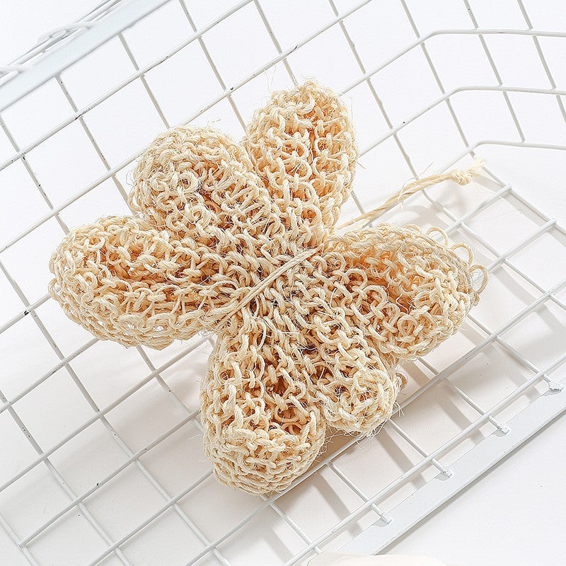 Natural loofah sponge on a white grid background
