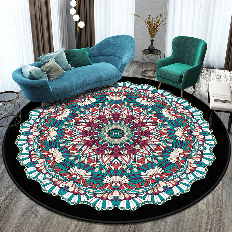 Round mandala rug with colorful patterns in a living room setting.