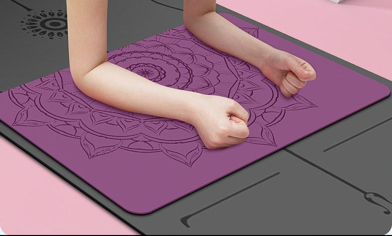 Person doing a yoga pose on a pink mat with a pink wall in the background