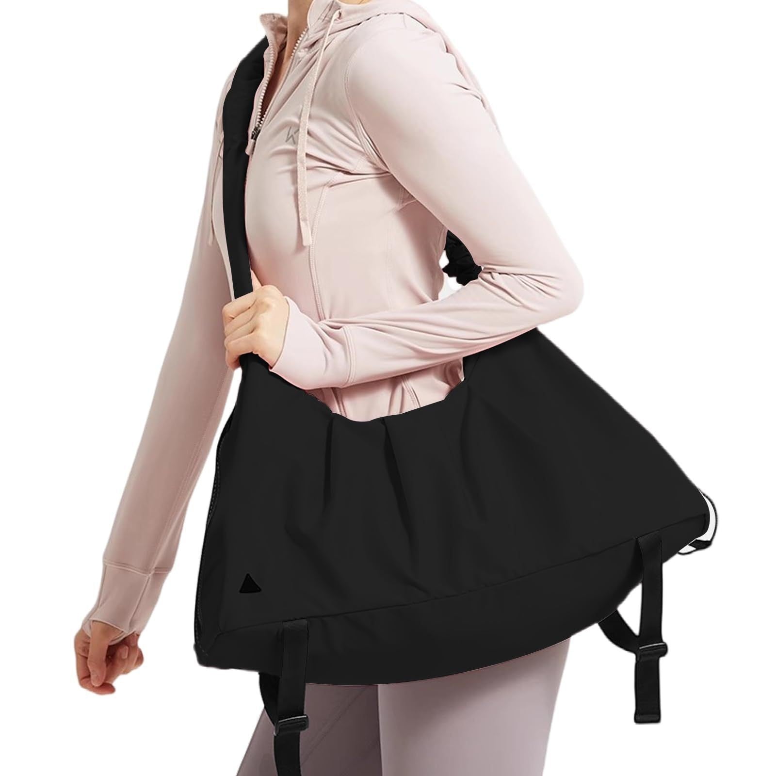 Person wearing a black backpack with a plain background