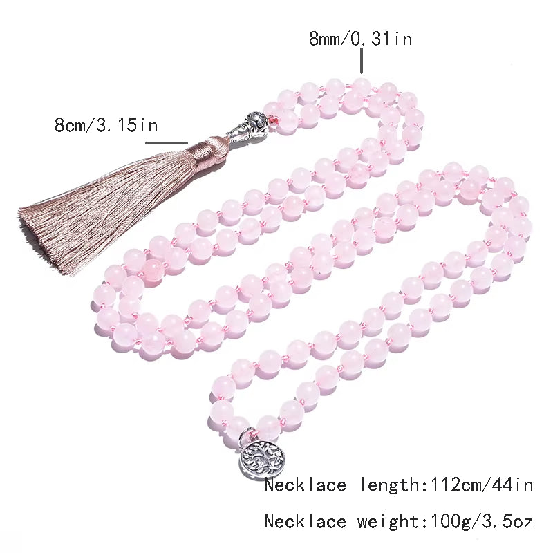 Pink beaded necklace with tassel and measurements on a white background