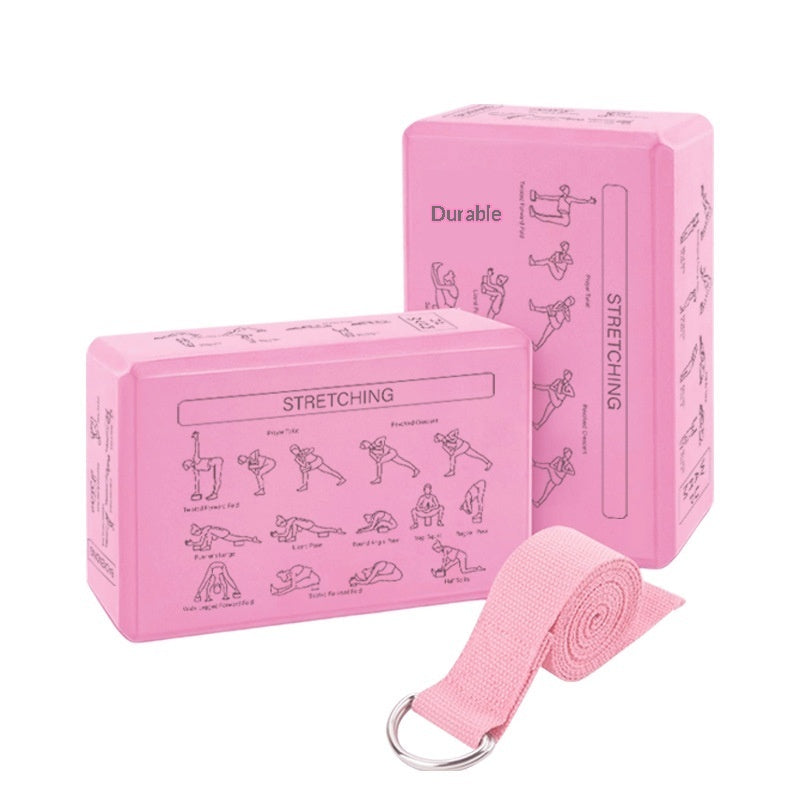 Pink yoga block, pink yoga strap, and pink yoga mat with stretching illustrations on a white background