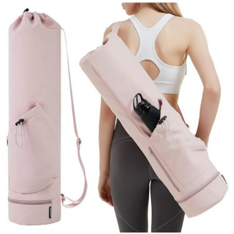 Pink yoga mat bag with rolled-up yoga mat and water bottle, person wearing sports bra and leggings.