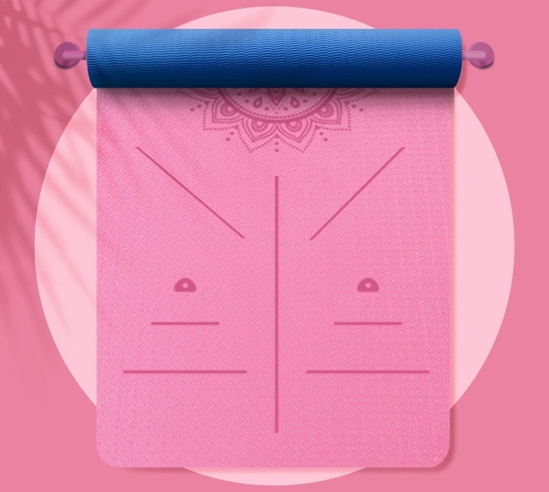 Pink yoga mat with blue top on a pink background