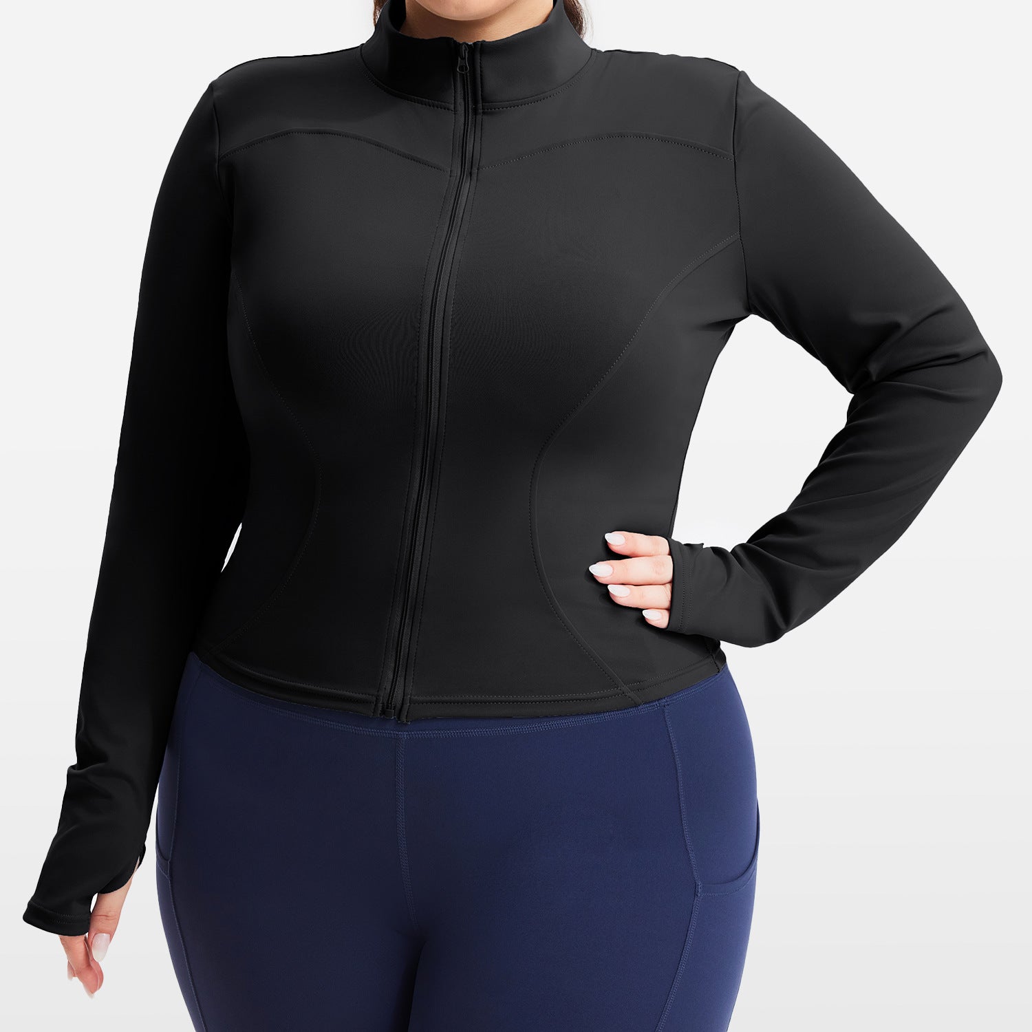 Person wearing a black jacket and blue leggings on a white background