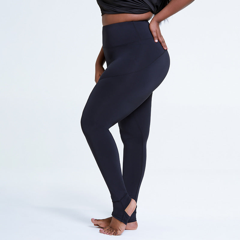 Person wearing black leggings on a white background