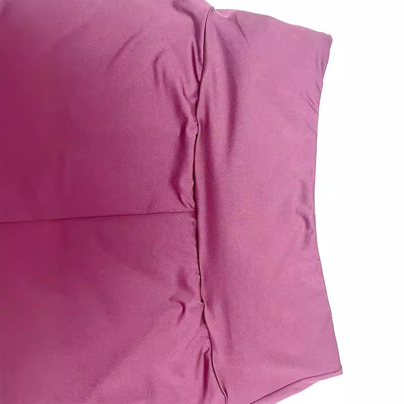 Close-up of a pink pillow with a white background