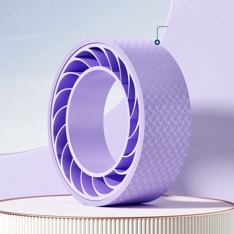 Purple yoga wheel on a light purple background with 'Yoga Wheel' label.