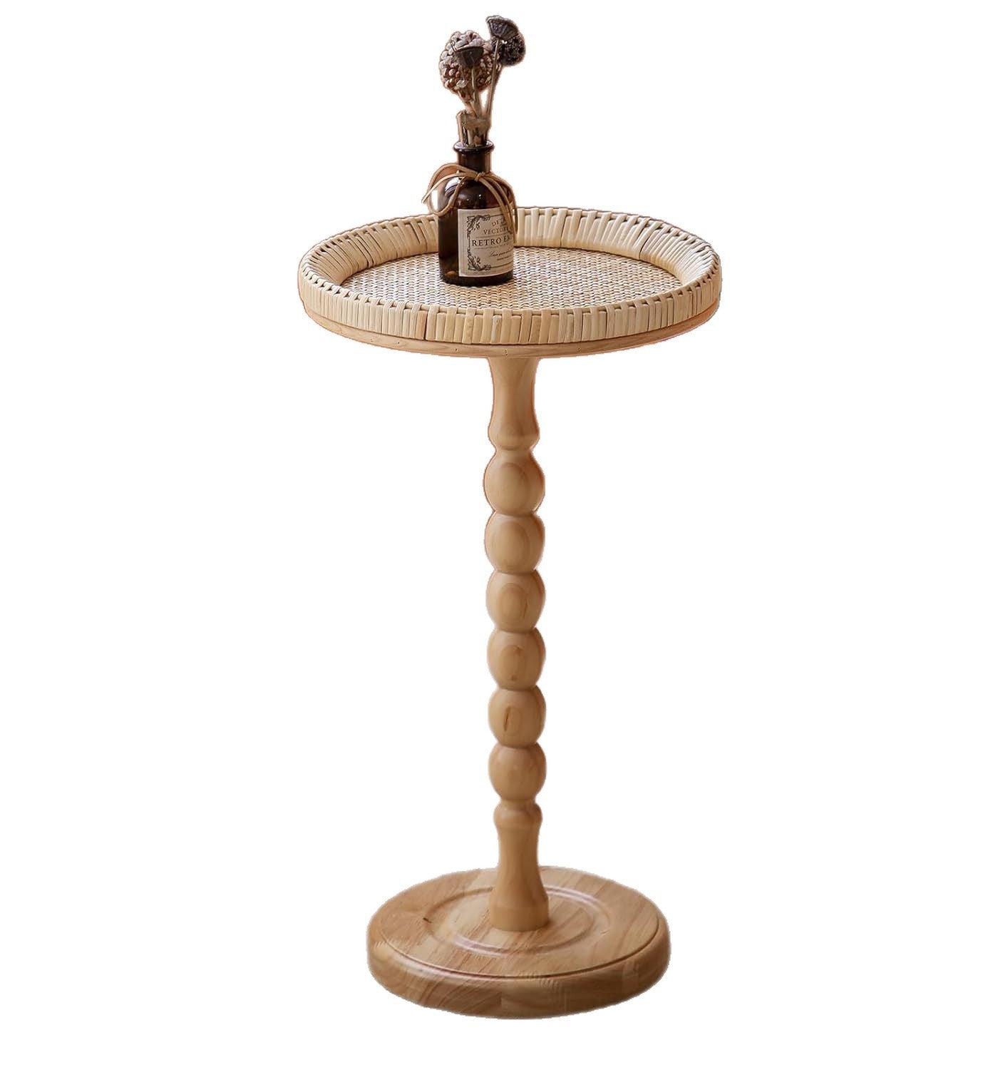 Wooden side table with wicker top on a white background