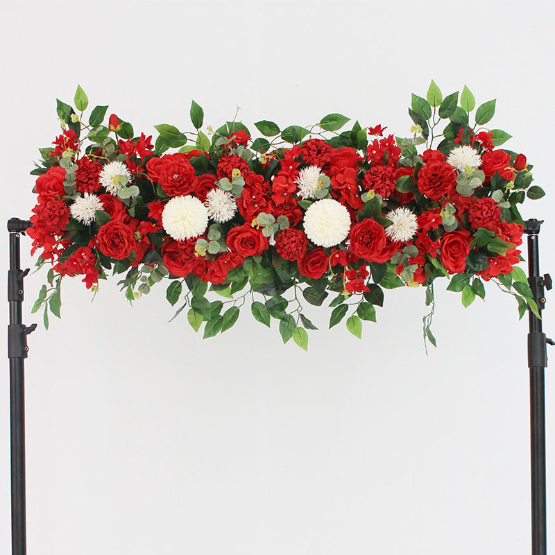 Floral arch with red and white flowers on a white background