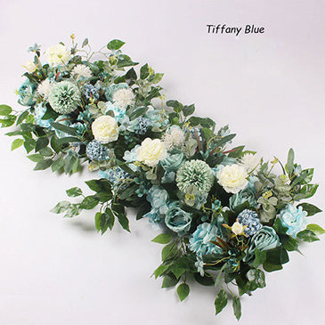 Artificial floral arrangement with green and blue tones on a white background, labeled 'Tiffany Blue'.