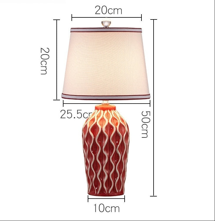 Red and white lamp with dimensions labeled on a white background