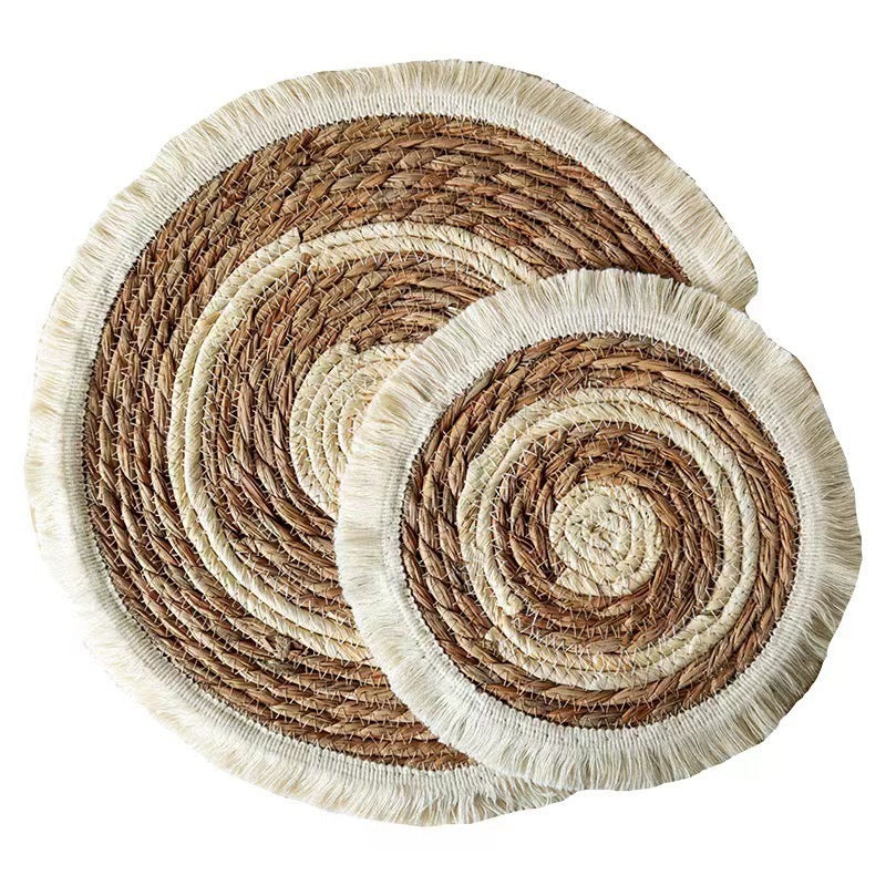 Set of three woven placemats with concentric circle pattern on a white background
