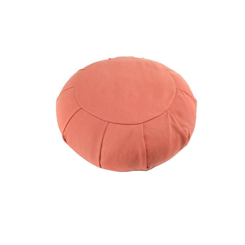 Round pink cushion on a white background