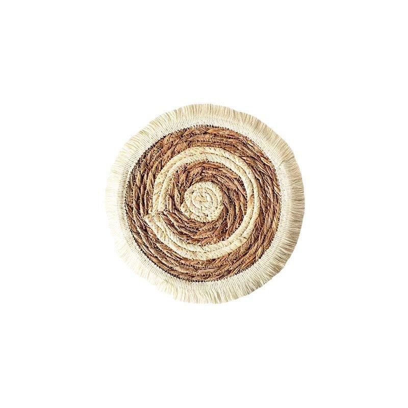 Round woven mat with a spiral pattern on a white background