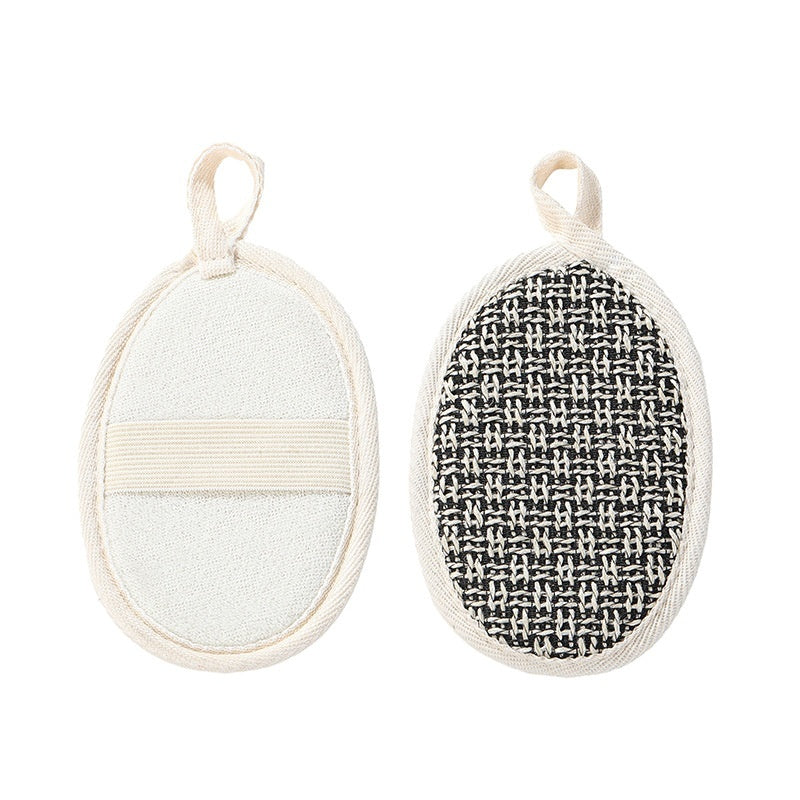 Two oval scrubbers with textured surfaces on a white background