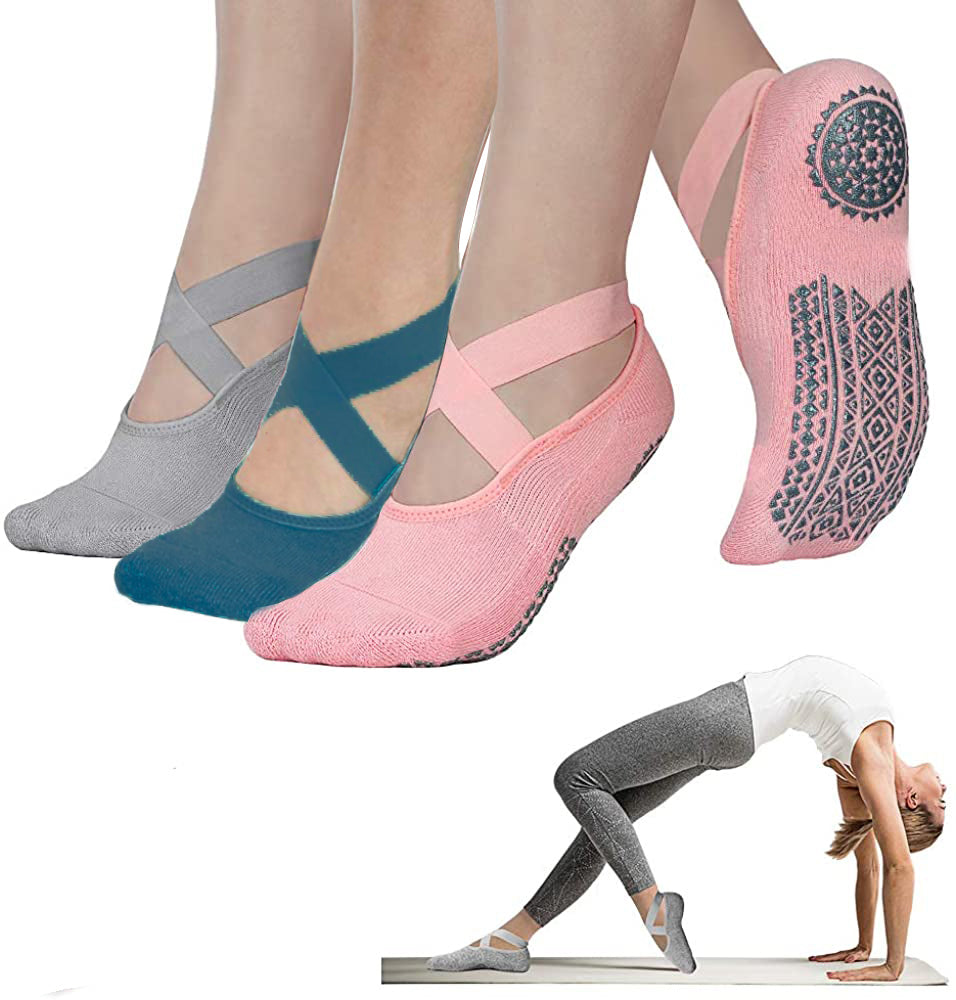 Set of four pairs of yoga socks with a woman demonstrating their use on a white background.