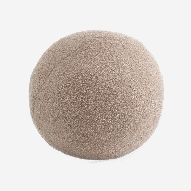 Round beige pouf on a white background