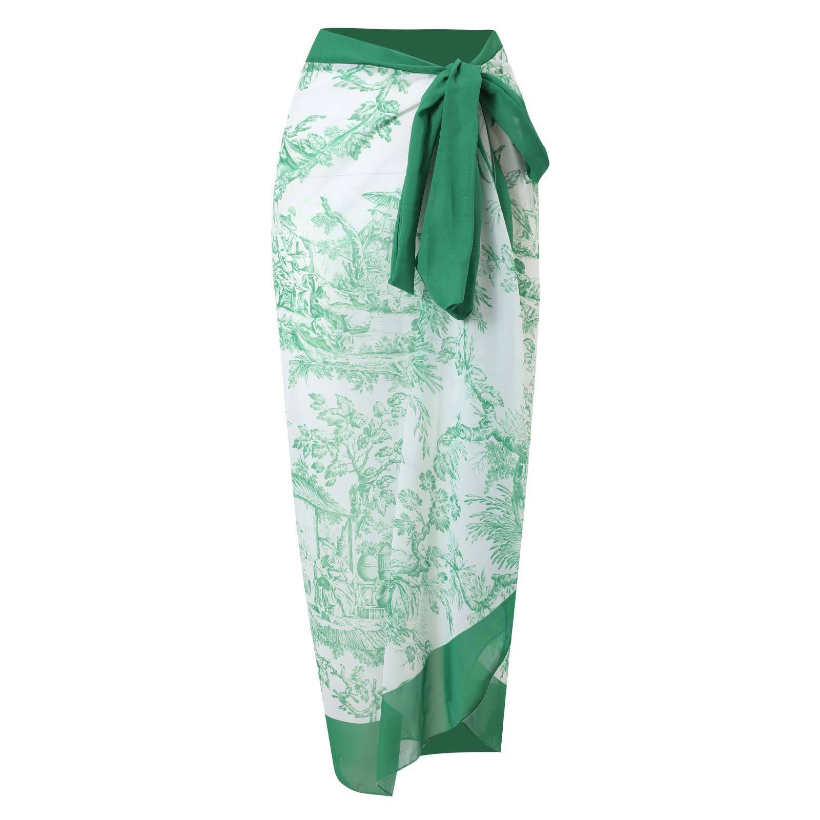 Green and white patterned skirt with a tie waist on a white background