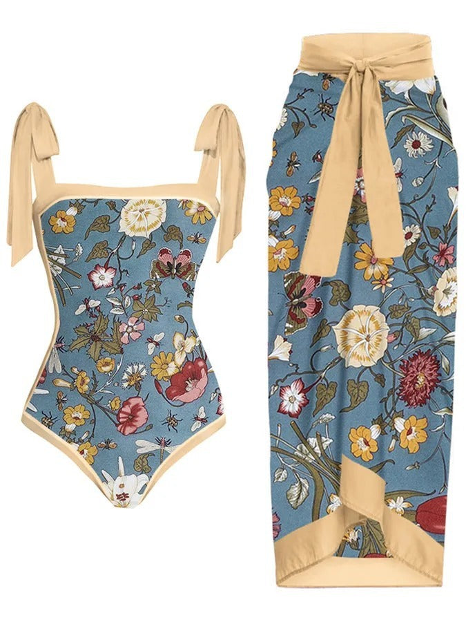 Floral-patterned swimsuit with beige straps on a white background