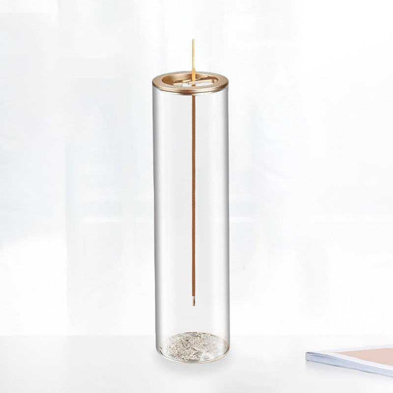 Tall, clear cylindrical vase with a gold accent on a white background