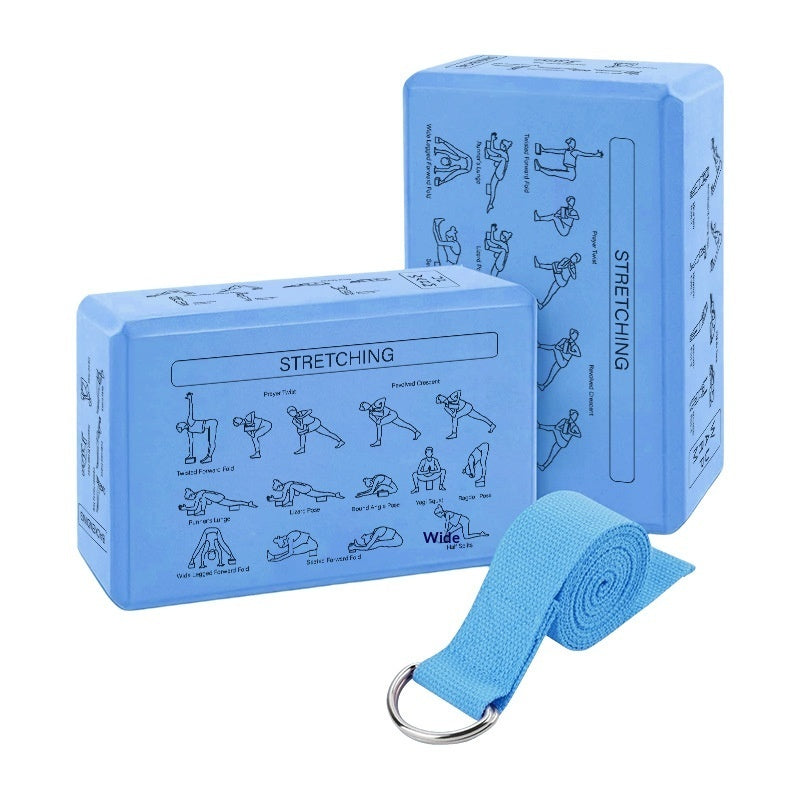 Two blue yoga blocks with stretching illustrations and a matching blue strap on a white background